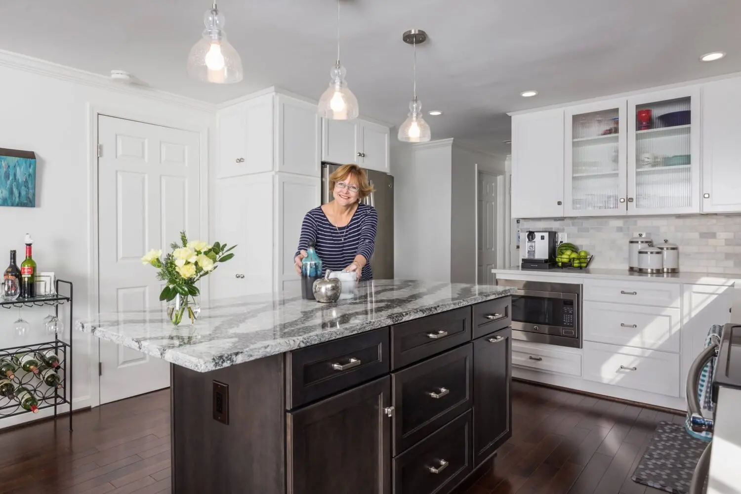 a woman standing in a kitchen