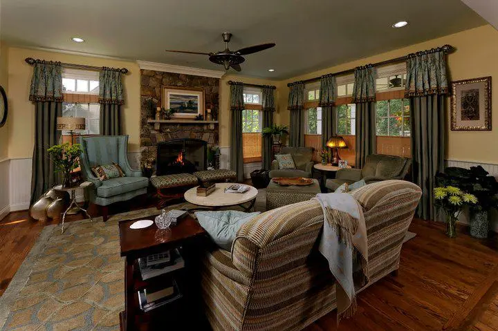 a living room with a fireplace and couches