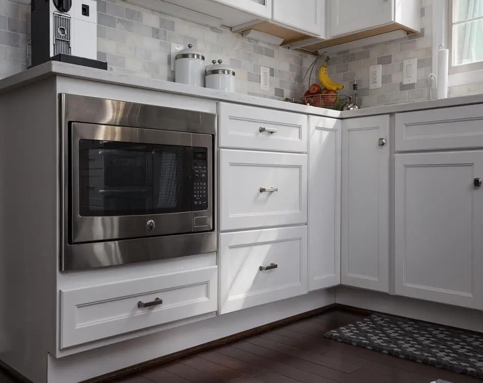 a kitchen with a marble island and a stove