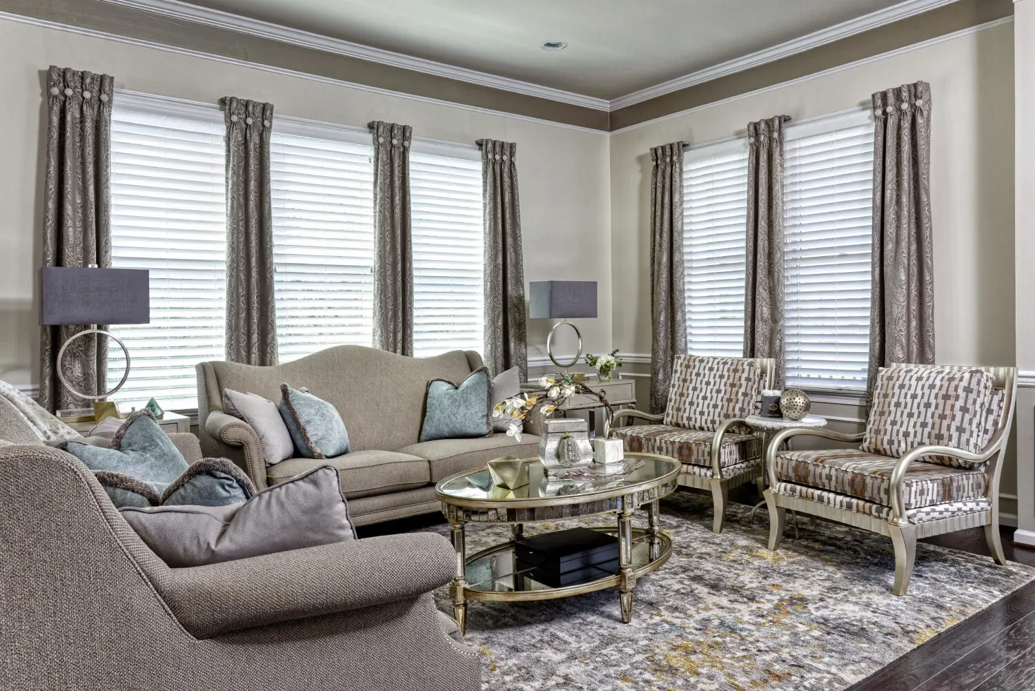 a living room with a couch and chairs