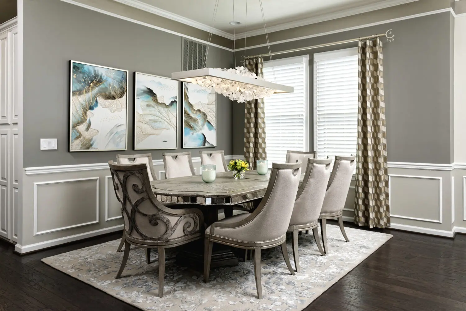 a dining room with a table and chairs