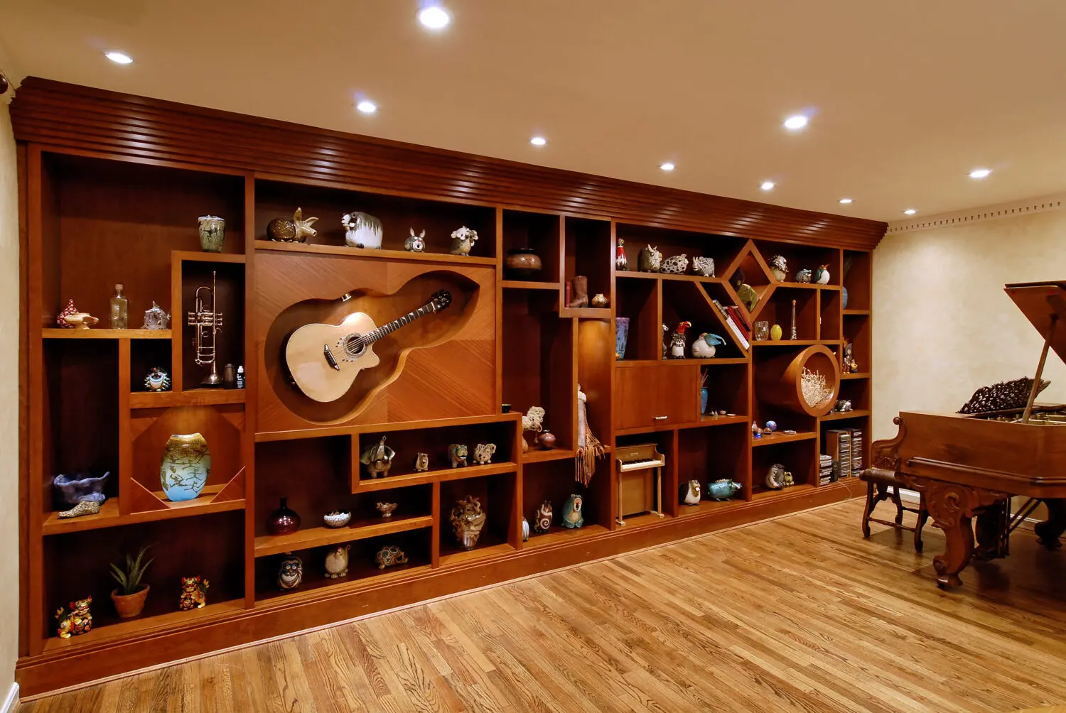 a room with a guitar and shelves