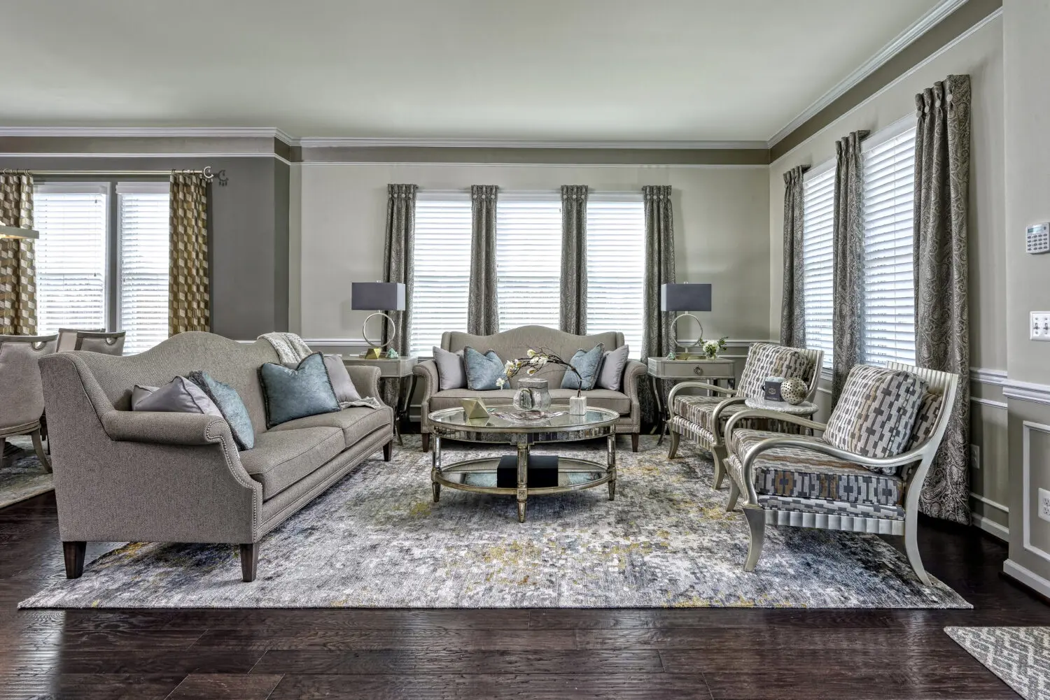a living room with a couch and chairs