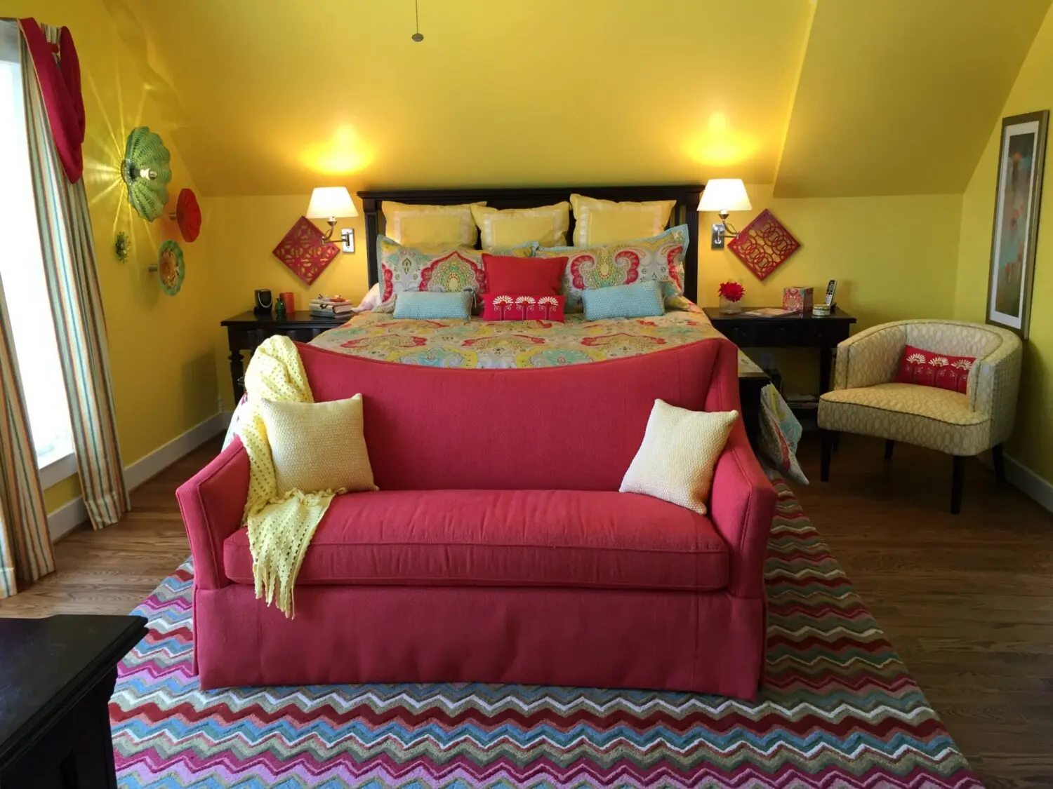 a bedroom with a bed and a couch