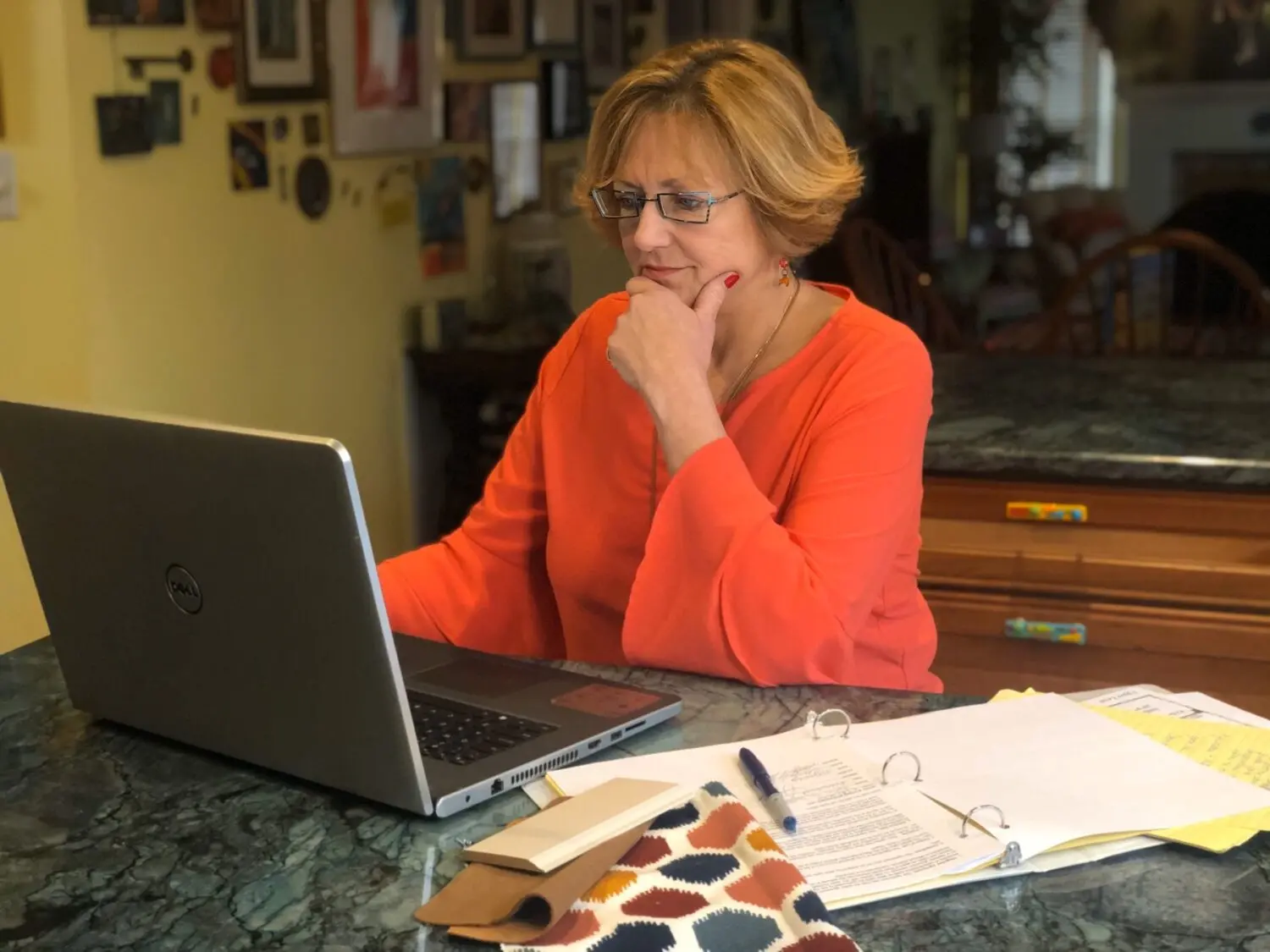 About 6 | Award Winning Interior Designers Washington Dc &Amp; Northern Virginia Areas a woman sitting at a table looking at a laptop